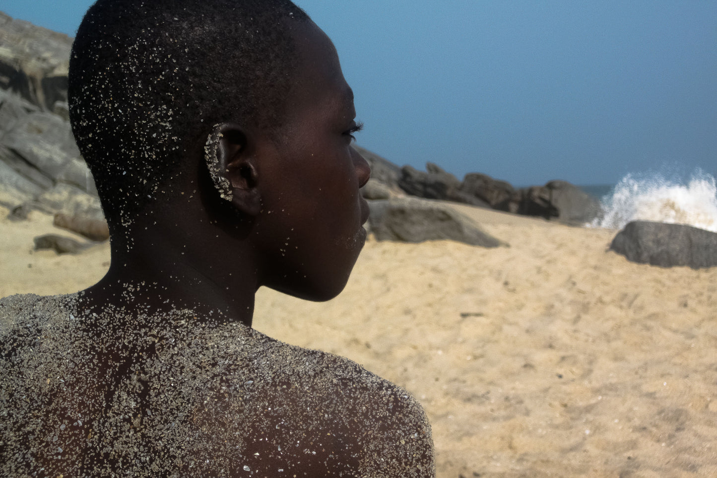 Boy Gazing On Beach
